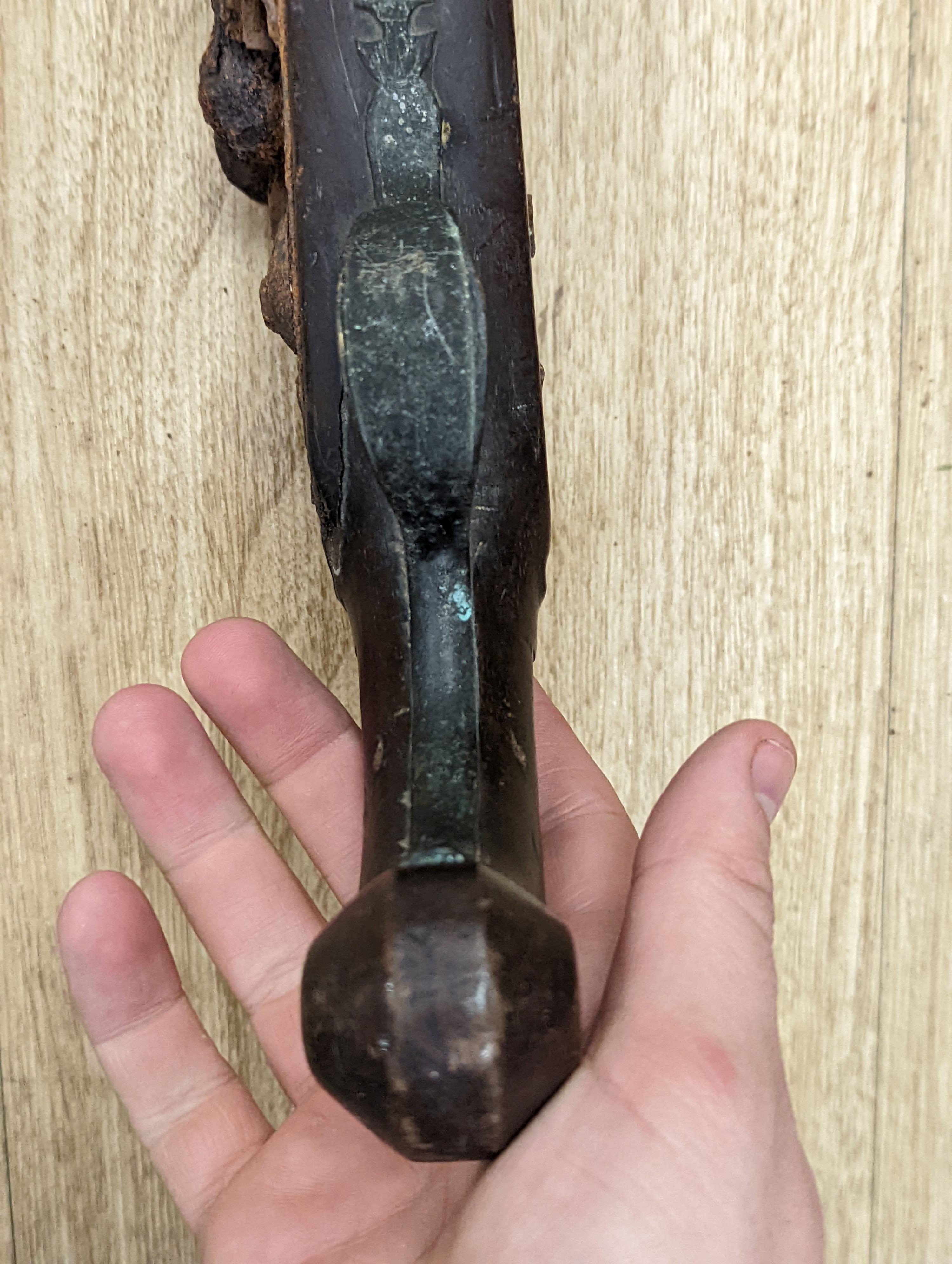 Two 19th century flintlock pistols and a pocket pistol, largest 40 cms long.